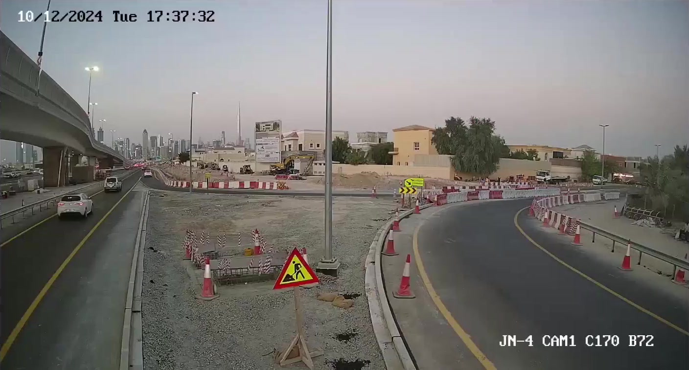 Elevated camera view of a road junction with one road curving right